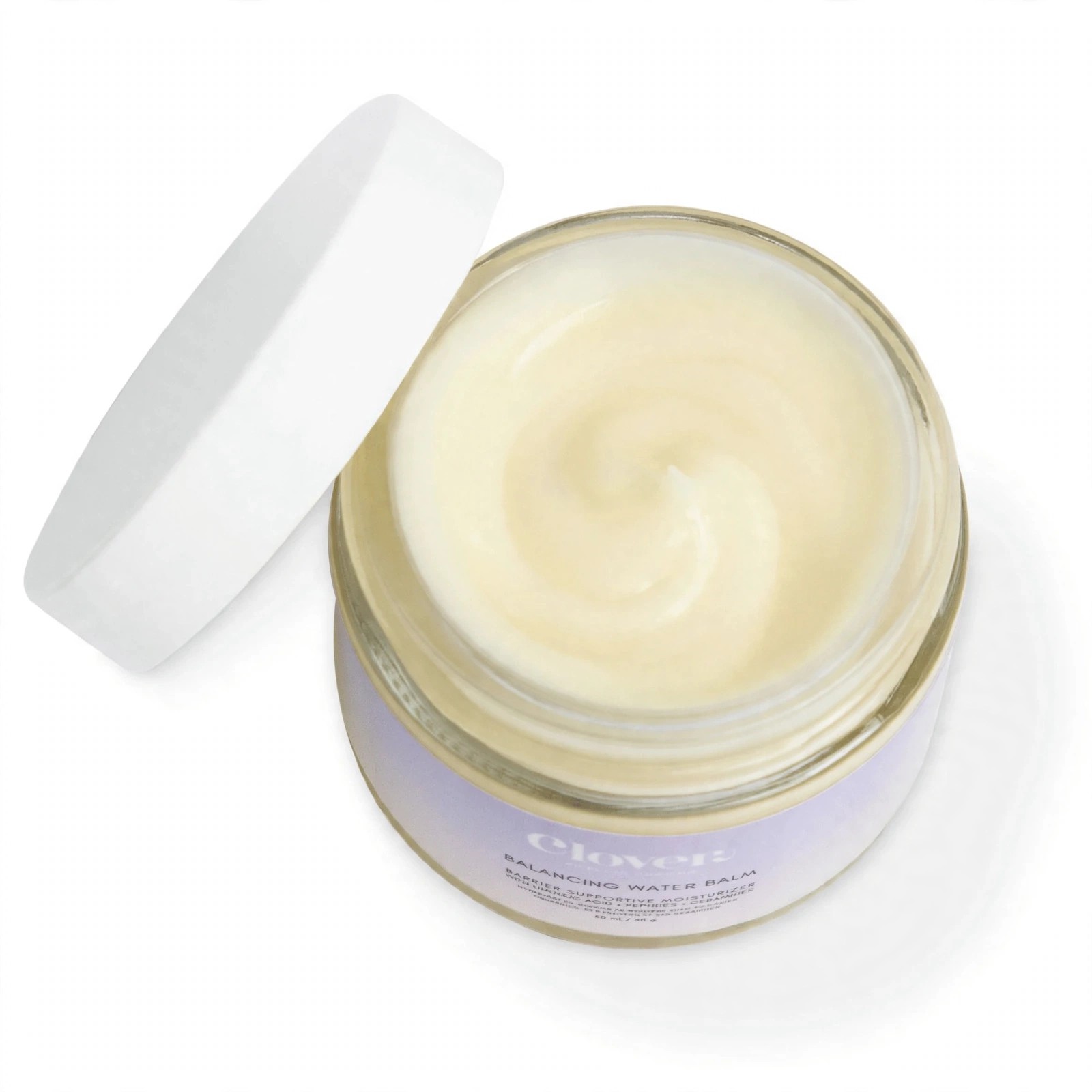 Open jar of Balancing Water Balm showing creamy texture.