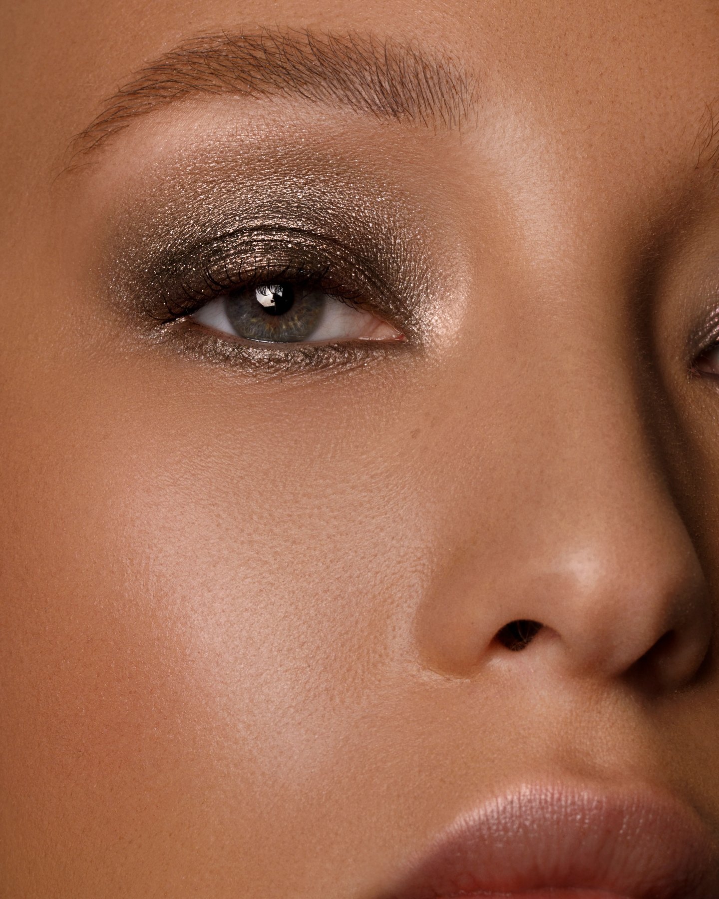 Closeup of eye wearing shimmering dark Ash and Ember Eye Soot.